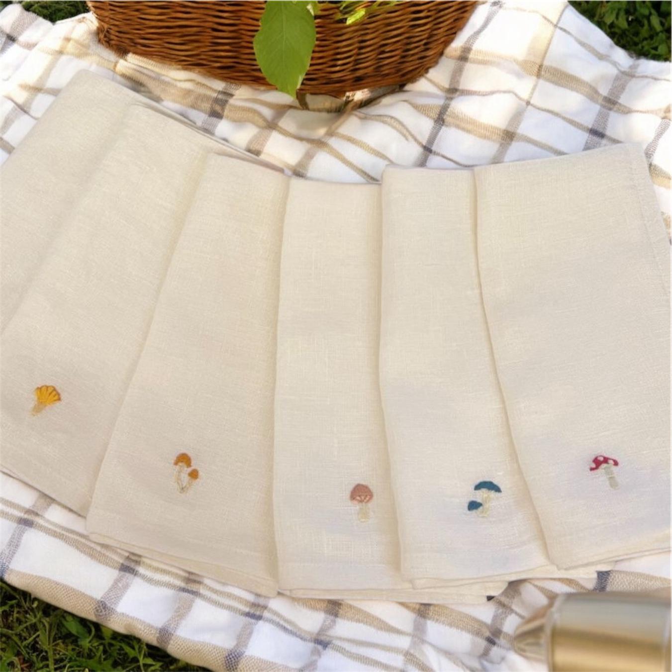 Embroidered Mushroom Napkin Set in a styled picnic setting with a basket.