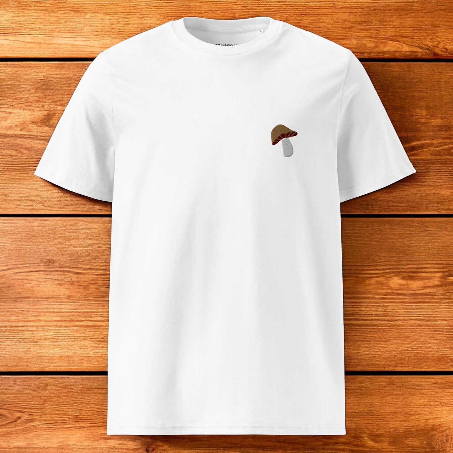 white t-shirt with a porcini mushroom and a wood background