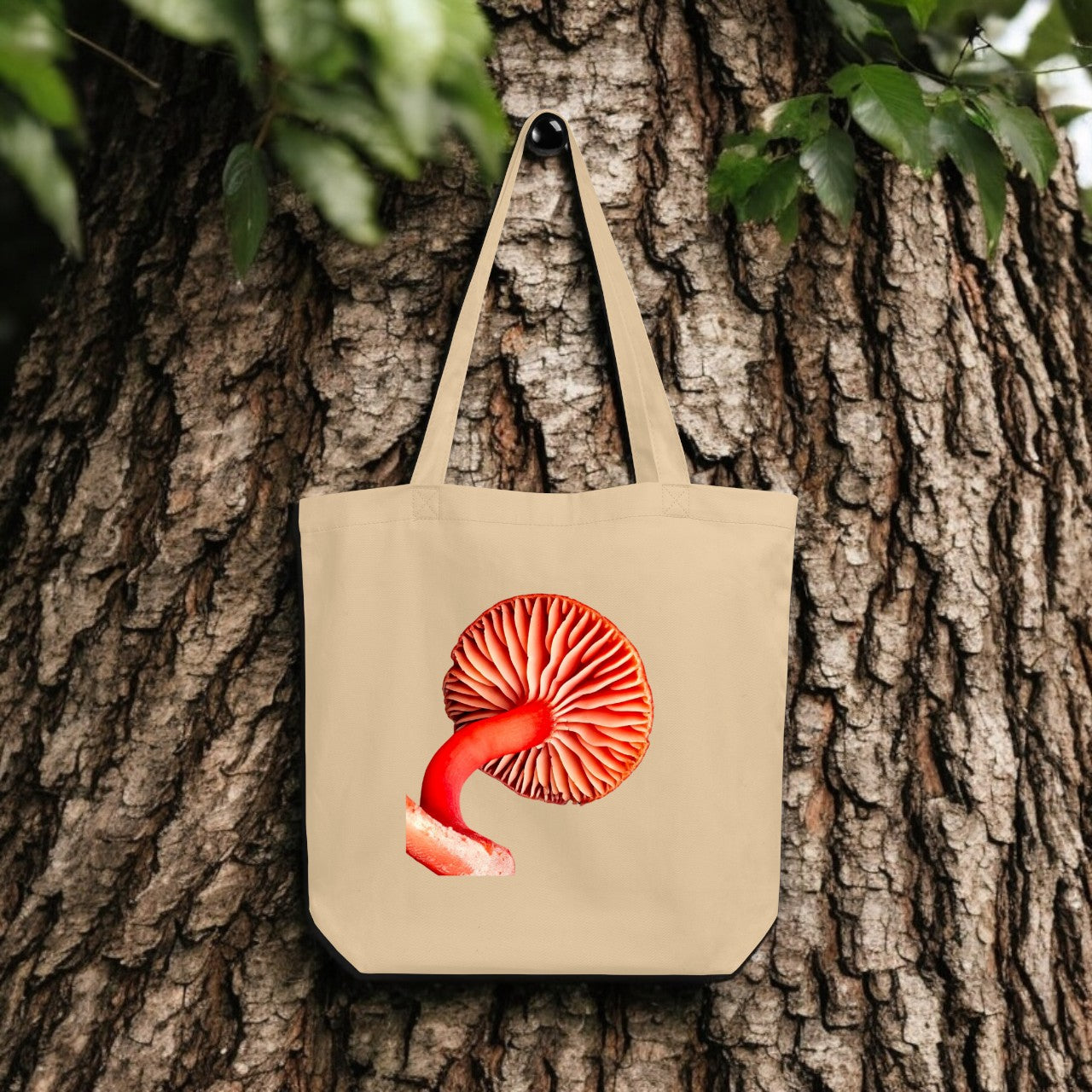 Hygrocybe Red Mushroom Gill Tote Bag - beige canvas with detailed mushroom underside print, outdoor setting.