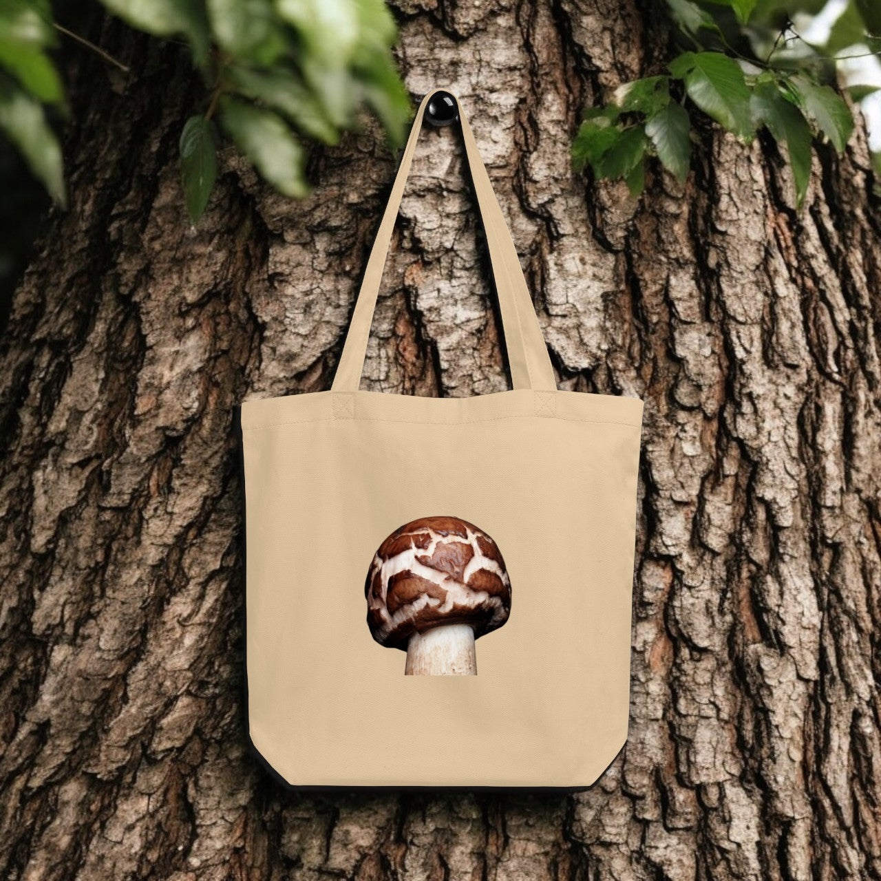Chlorophyllum Brown and White Patterned Mushroom Tote Bag - beige canvas with detailed mushroom underside print, outdoor setting.