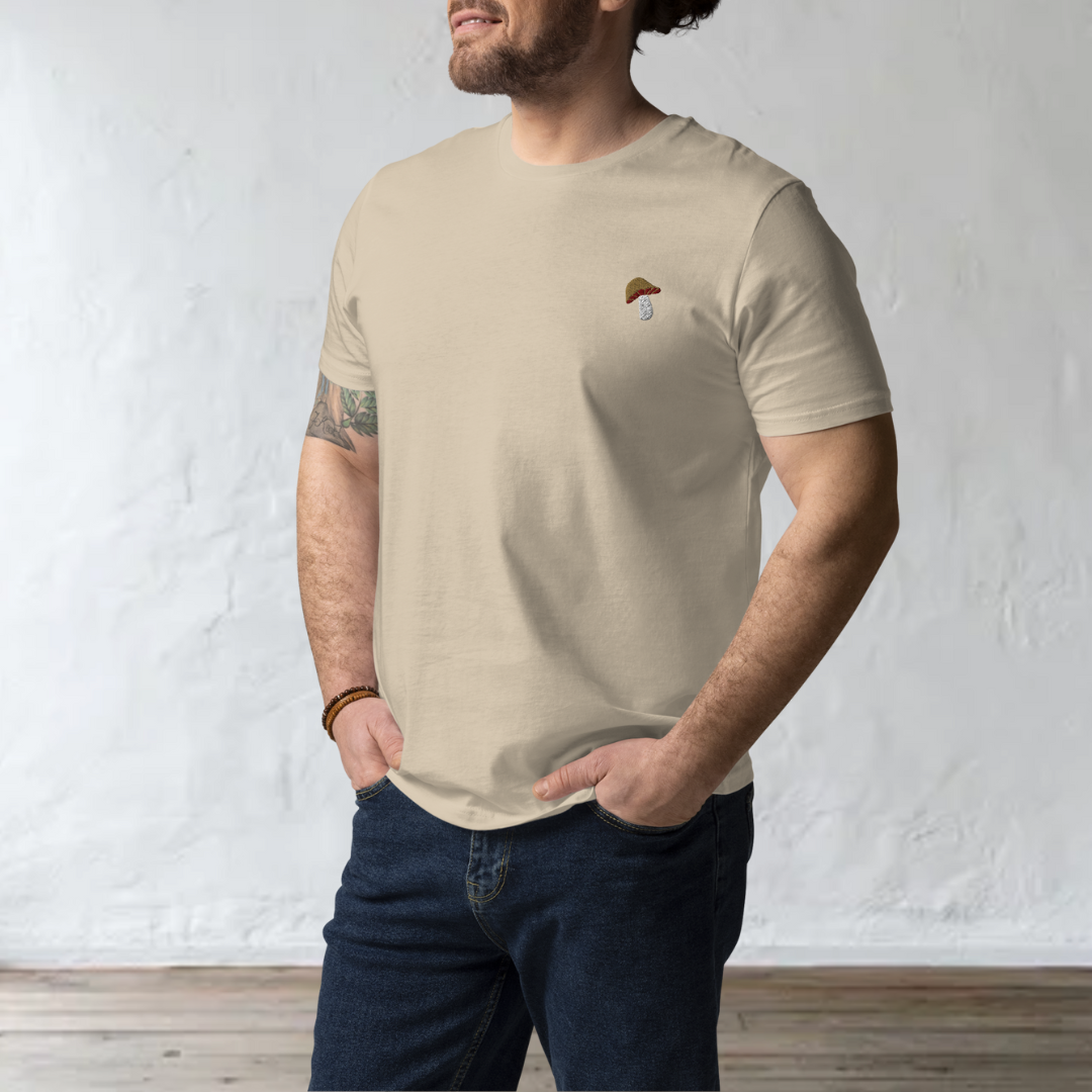 male model wearing a beige t-shirt with a porcini mushroom