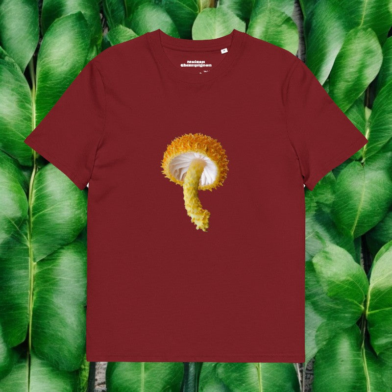 Cyptotrama red T-shirt on green leaves