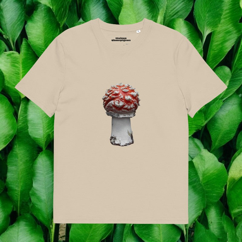 Amanita Muscaria beige T-shirt on green leaves