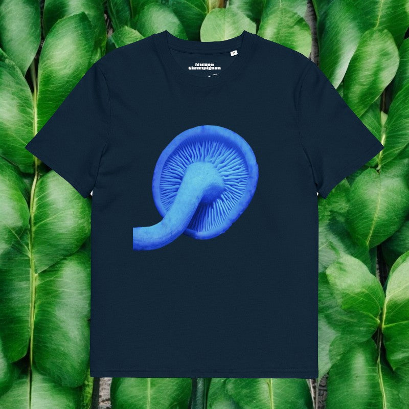 Blue Rhodocollybia on a navy blue T-shirt on green leaves