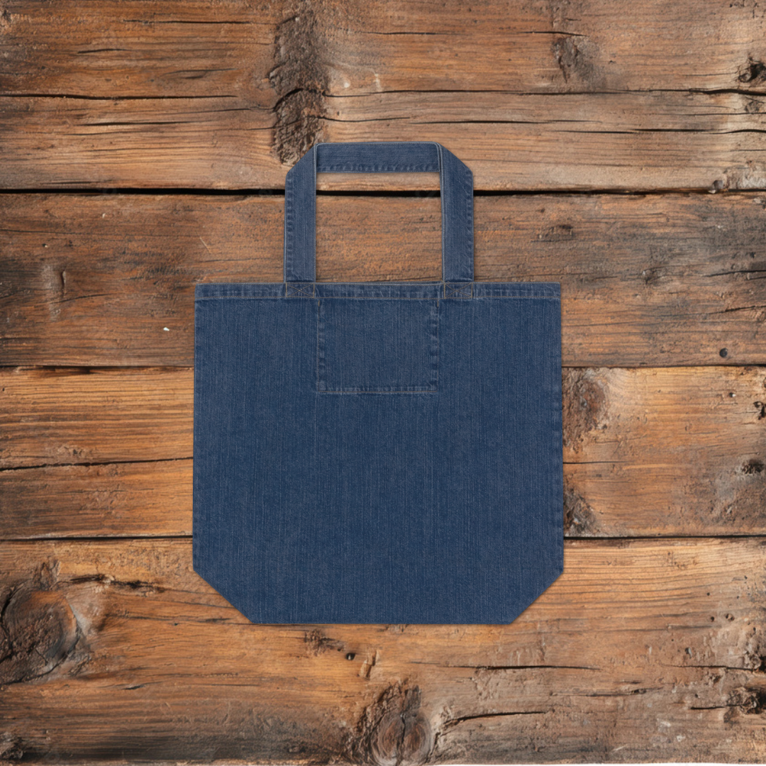 Back of a denim tote back, on a wooden floor