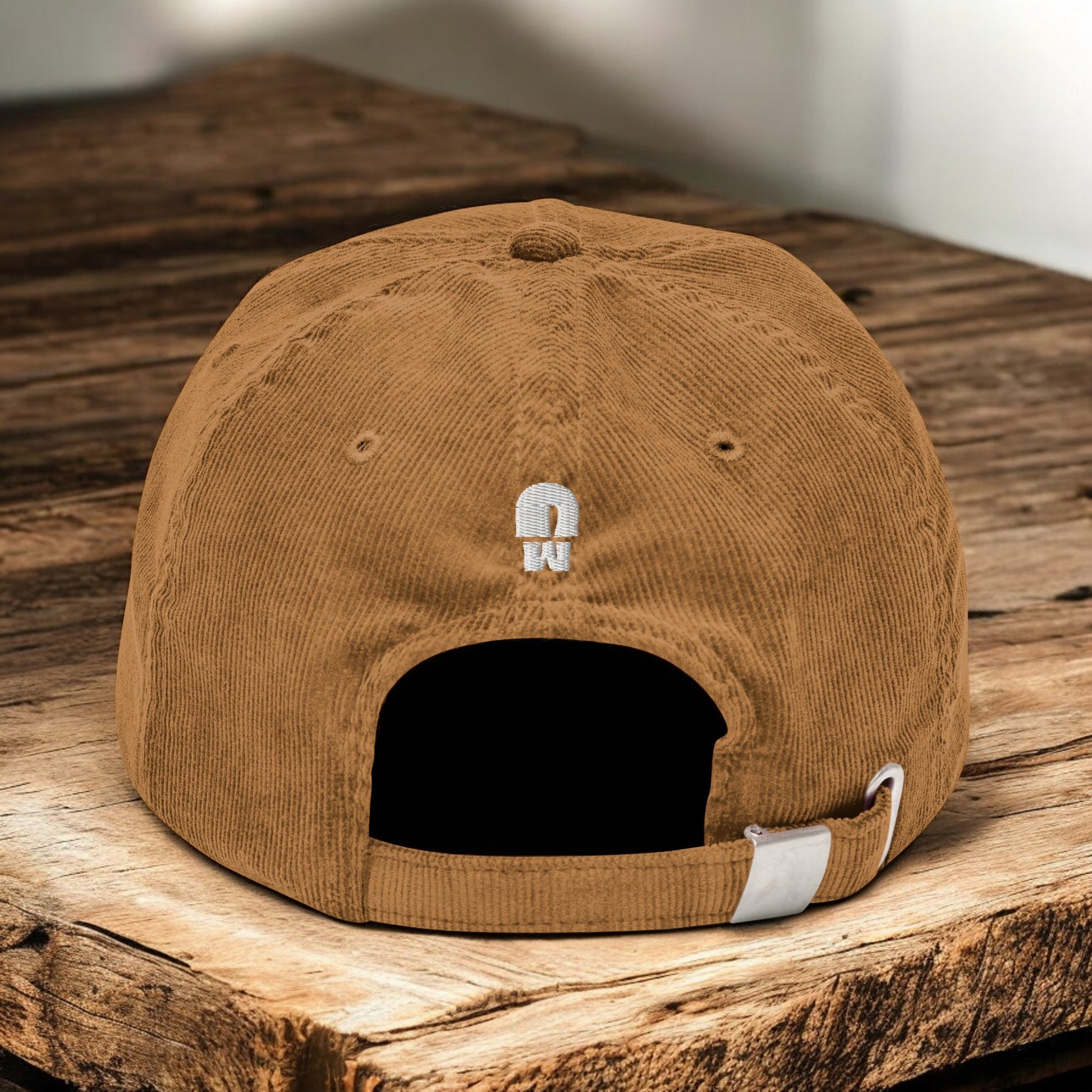 Camel Corduroy Paris Mushroom cap from the back on a wooden surface