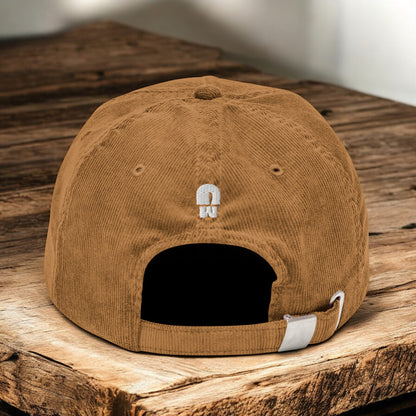 Camel Corduroy Paris Mushroom cap from the back on a wooden surface