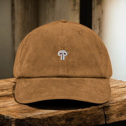 Camel Corduroy Paris Mushroom cap from the front on a wooden surface