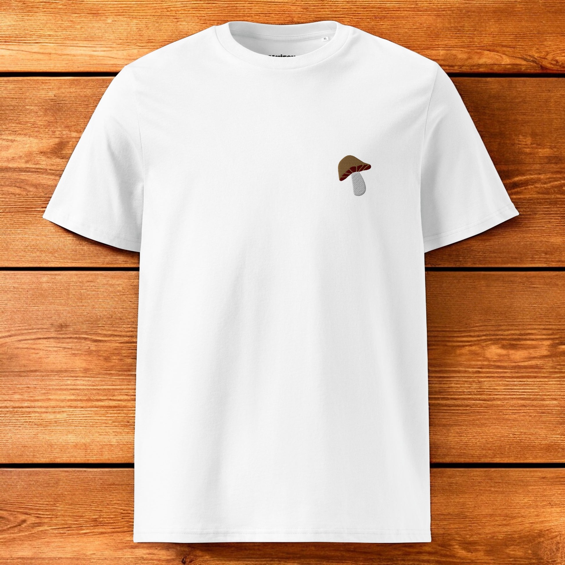 white t-shirt with a porcini mushroom and a wood background