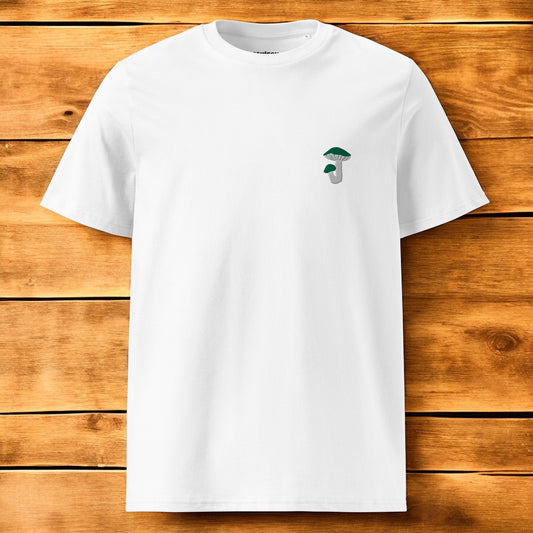 white t-shirt with a green russula mushroom and a wood background