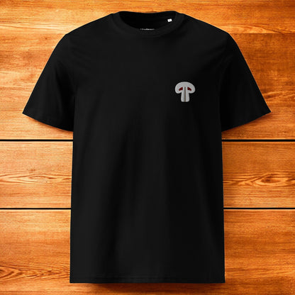 black t-shirt with paris mushroom and a wood background
