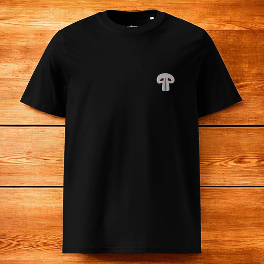 black t-shirt with paris mushroom and a wood background